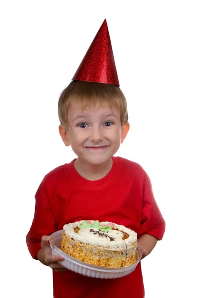 Glücklicher Junge mit einem Kuchen — Stockfoto