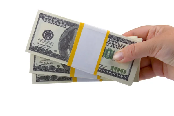 Große Dollarpakete in der Hand — Stockfoto