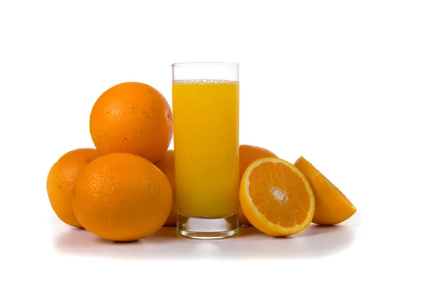 Fresh oranges and orange juice — Stock Photo, Image