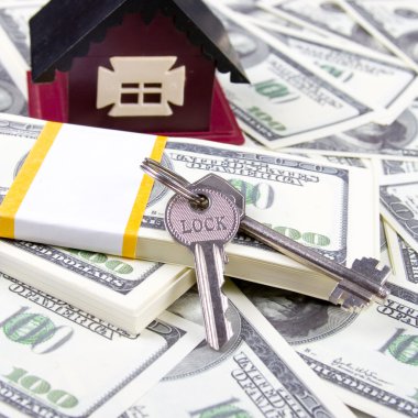 House and keys of one hundred dollar bills background clipart