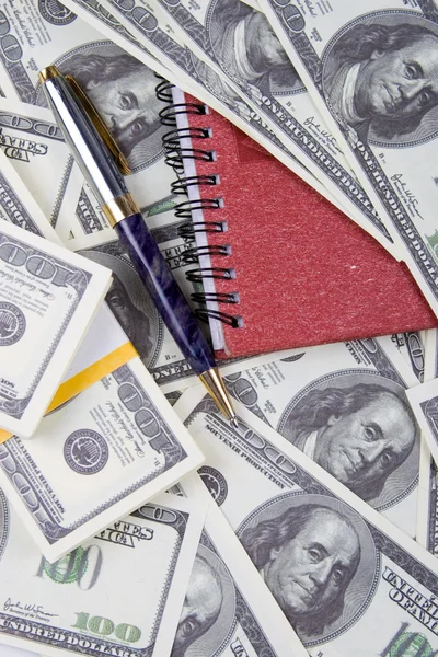 Dólares, caderno e caneta — Fotografia de Stock