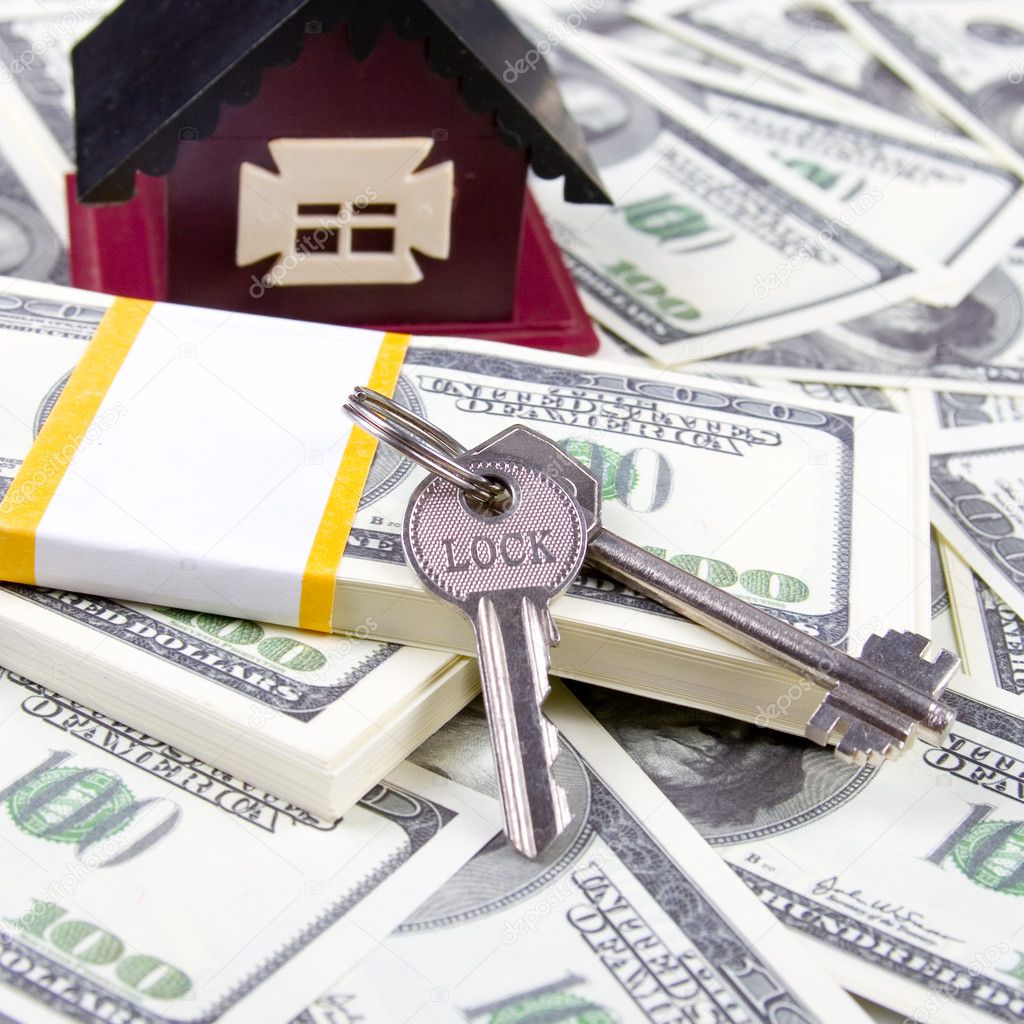 House and keys of one hundred dollar bills background