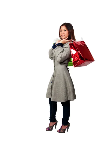 Mulher hispânica com sacos de compras — Fotografia de Stock