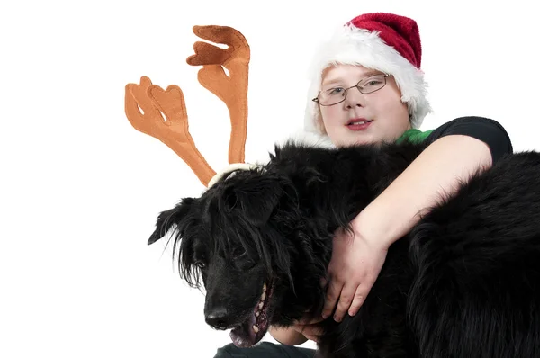A Christmas boy and his reindeer dog — Stock Photo, Image