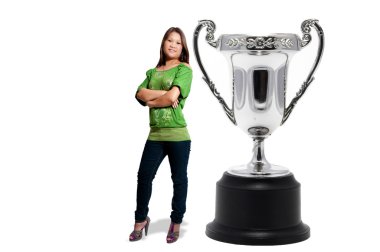 A beautiful hispaniv woman standing beside a silver championship cup, sports trophy award. clipart