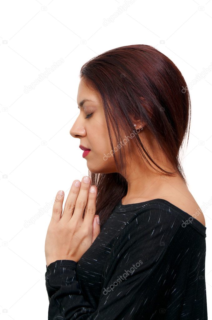 Beautiful Hispanic Latino Christian woman in deep prayer