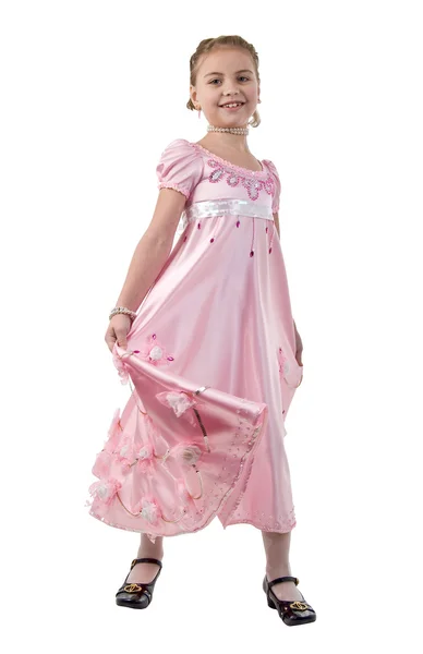 Lilla flickan ser ut som en liten prinsessa i vacker rosa klänning. — Stockfoto