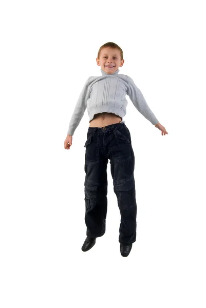Kot pantolon çocuk atlama. Stüdyo beyaz arka plan üzerinde ateş. — Stok fotoğraf