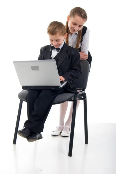Schoolboy, Schoolgirl And Laptop.Studio Shoot Over White Backgro — Stock Photo, Image