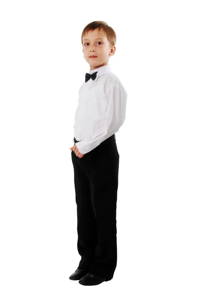Niño de la escuela casual sobre fondo blanco. Vista lateral . — Foto de Stock