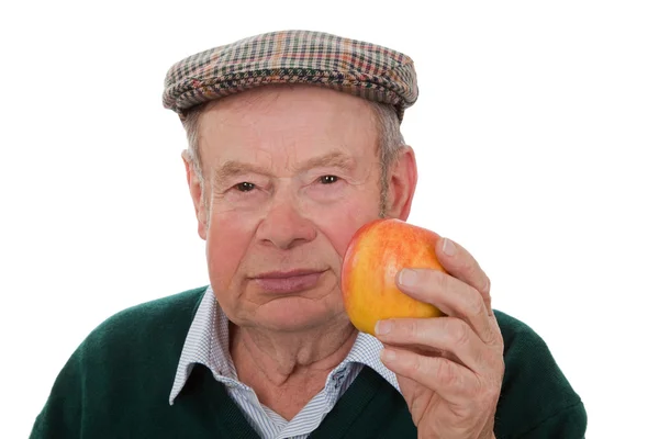 Alter Mann mit Apfel — Stockfoto