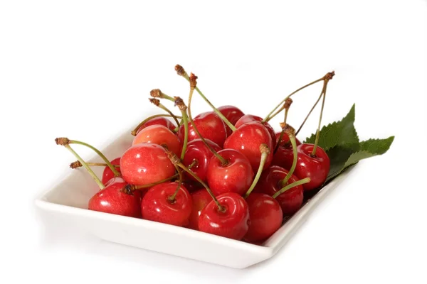Red cherries on a plate — Stock Photo, Image