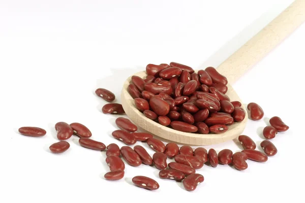 Red Kidney Beans on a cooking spoon — Stock Photo, Image
