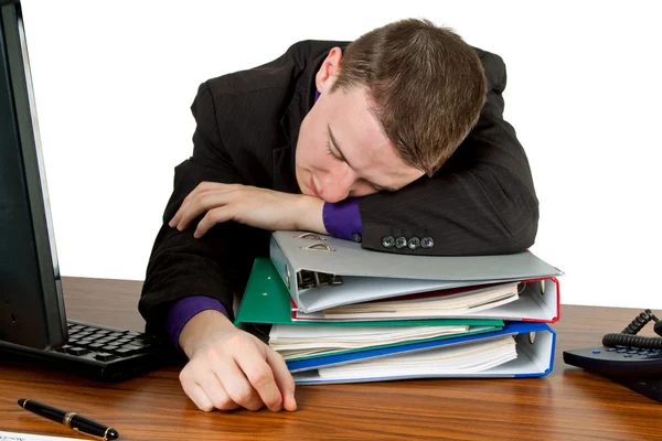 Młody Człowiek Śpi Niektóre Foldery Jego Biurko Białym Tle — Zdjęcie stockowe