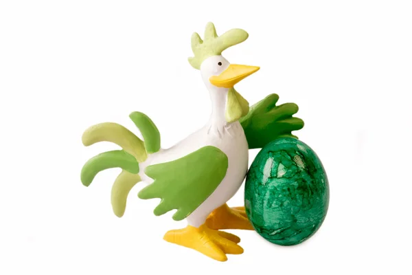 Петух с зеленым яйцом — стоковое фото