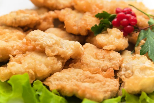 stock image Roast fish in dough with greens