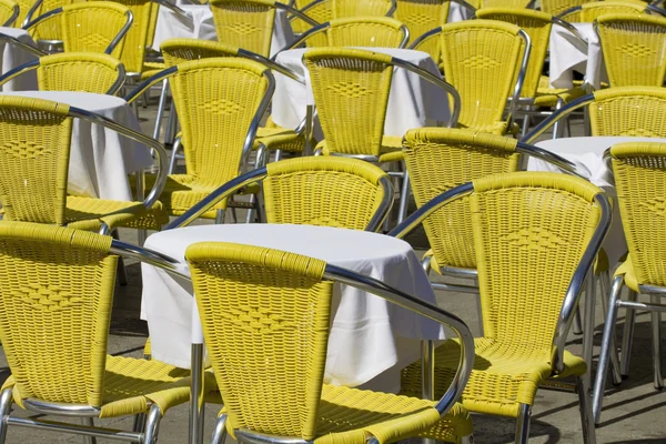 stock image Sidewalk cafe chairs and tables