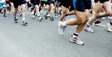 Marathon runners on city street clipart