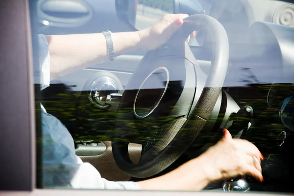 Senior woman driving a car — Stock Photo, Image
