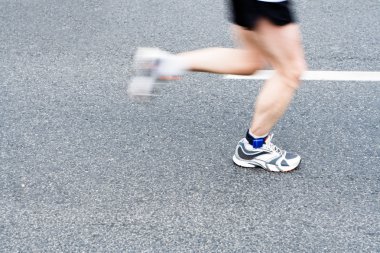 Running marathon on city street, motion blur clipart