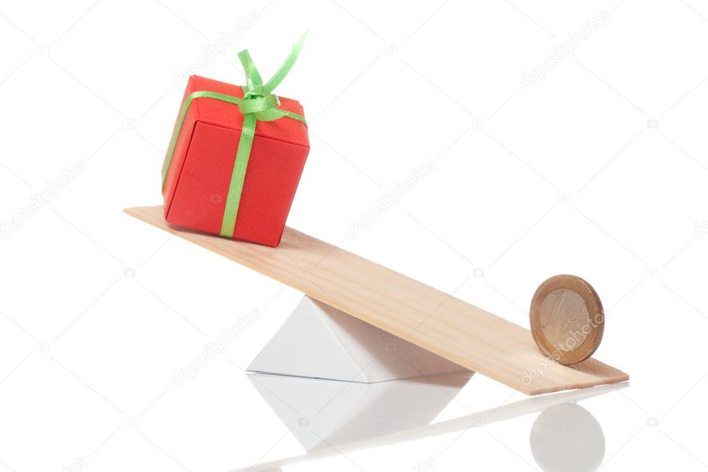 Present box balance with euro coin on white isolated background
