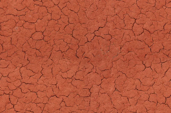 Stock image Cracked red textured surface seamlessly tileable