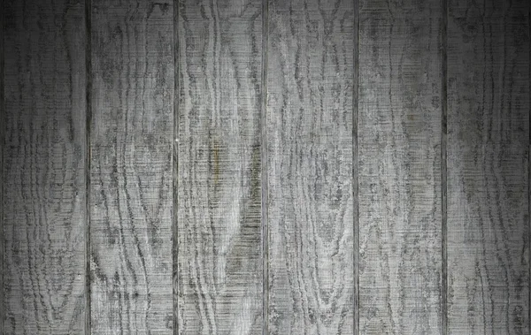 Verweerde grijze houten schuur gevelbekleding verlicht van bovenaf — Stockfoto