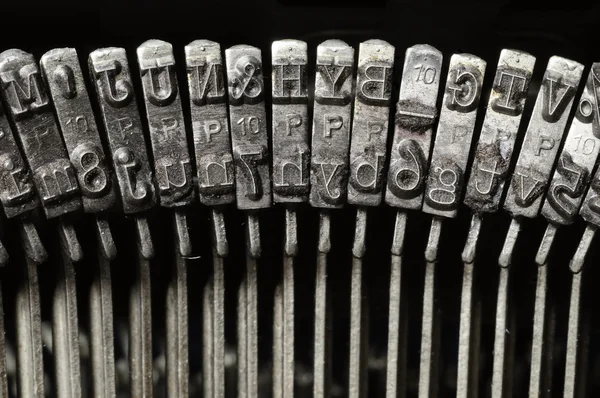 Close-up de letra de máquina de escrever e chaves de símbolo — Fotografia de Stock