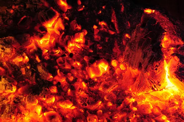 Burning embers in a molten fire — Stock Photo, Image