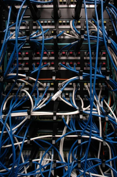 Banks of wires connecting network servers, telephones & digital — Stock Photo, Image
