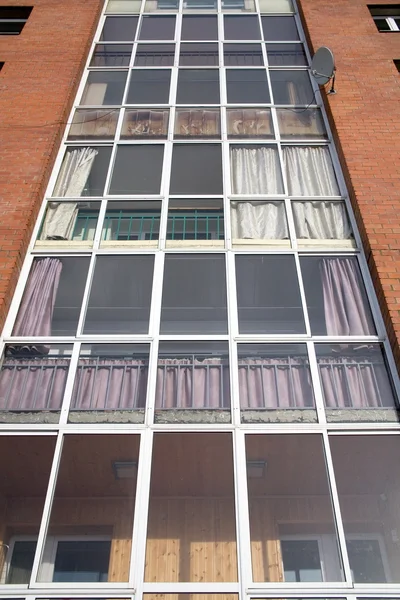 Brick building with glass balconies