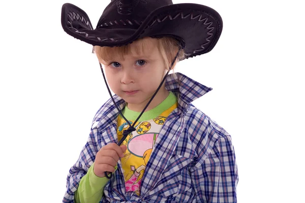 Dítě v kovbojském klobouku a kostkované košili. izolované na bílém. — Stock fotografie
