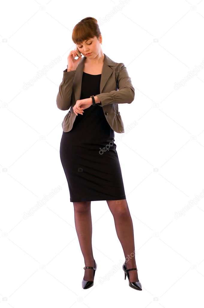Young business woman intently talking on the phone