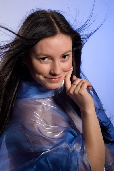 Cute girl in a transparent cloak — Stock Photo, Image