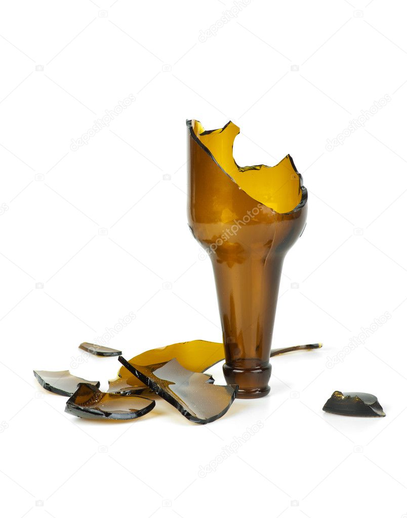 Smashed brown beer bottle isolated on the white background