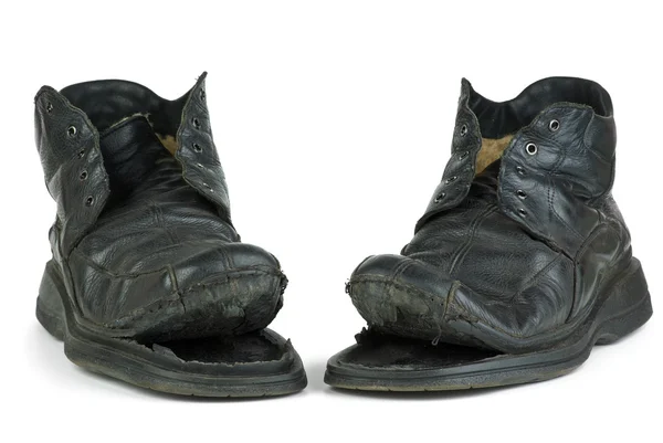 Par de botas velhas rasgadas — Fotografia de Stock