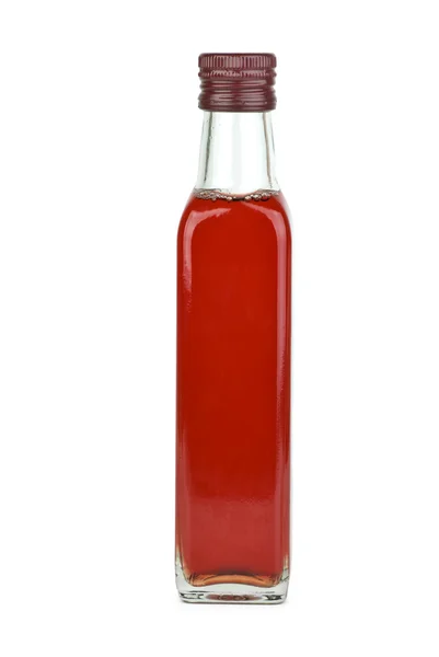 Garrafa de vidro com vinagre de vinho tinto — Fotografia de Stock