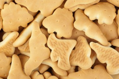 Abstract background: dinosaur-shaped cookies clipart