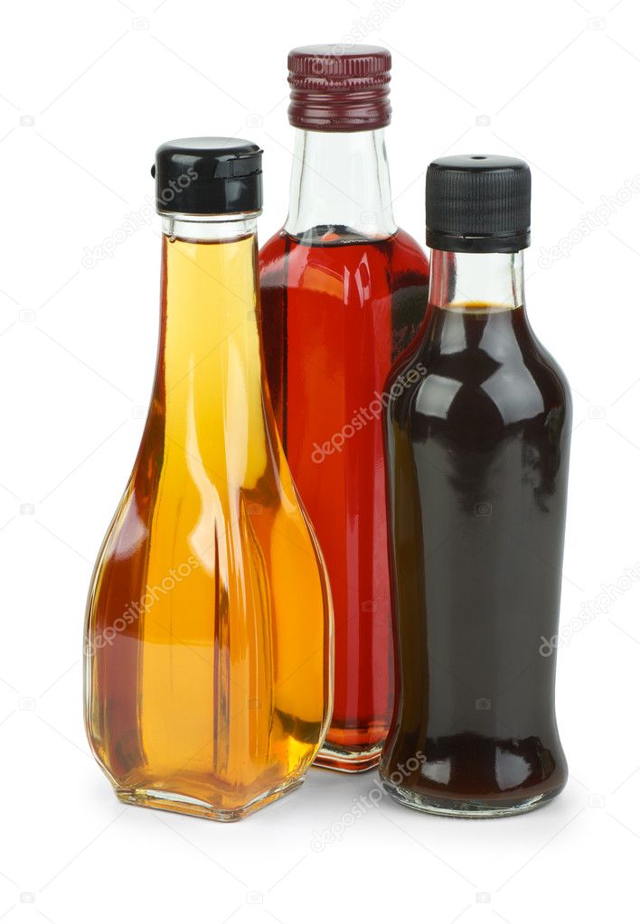 Bottles with apple and red wine vinegar and soy sauce isolated on the white background