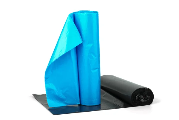 Rolls of blue and black plastic garbage bags — Stock Photo, Image