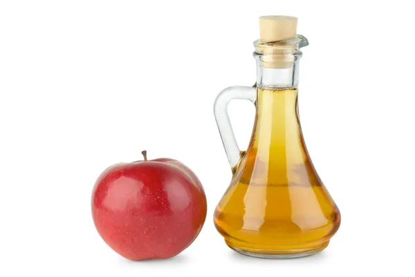 Karaff med äpple vinäger och rött äpple — Stockfoto