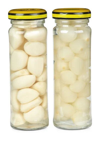 Glass jars with marinated garlic and onions — Stock Photo, Image