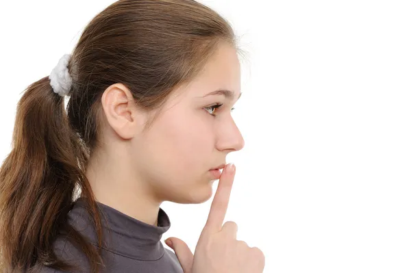 Jeune femme avec doigt sur les lèvres — Photo