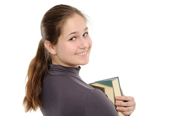 長い髪と白い背景の上の本を持つ若い女の子 — ストック写真