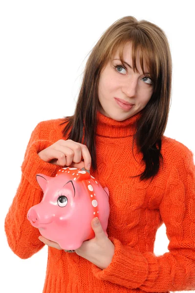 Young woman standing with piggy bank — Stock Photo, Image