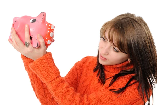Young woman standing with piggy bank — Stock Photo, Image
