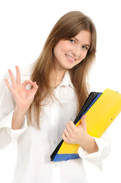 Młoda kobieta wskazuje znak ok — Zdjęcie stockowe