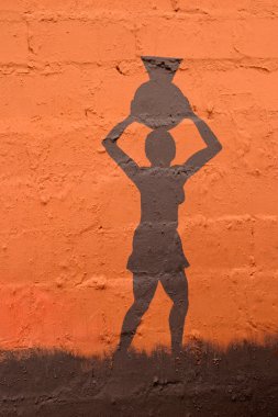 Illustration depicting an African woman carrying a clay pot on her head clipart