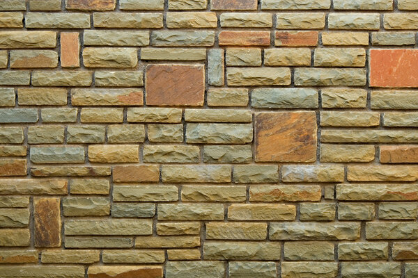 Brick wall background with multi-colored bricks