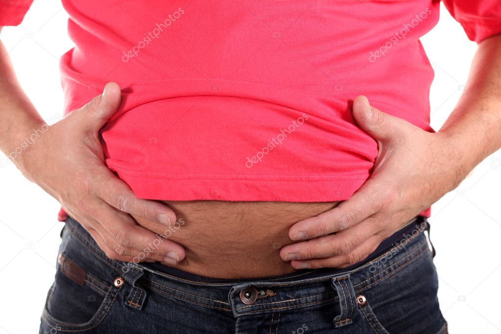 Overweight. Fat Businessman touching his stomach bursting through the shirt